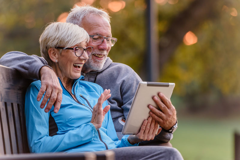 Vision impaired couple using technology